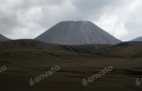Preview: Brown sandy foot of mount Batok early in the afternoon at the Tengger Semeru National Park in East