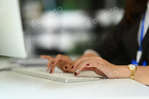Preview: Closeup shot of businesswoman typing on keyboard, searching information or browsing internet