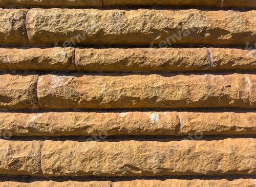 Preview: Stonewall background texture. Brown solid stone building facade material detai, closeup