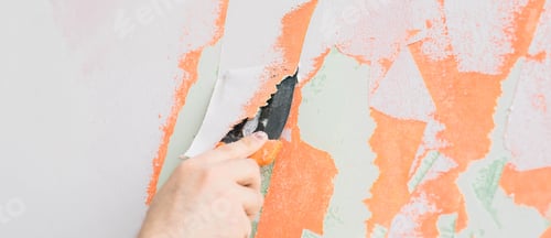 Preview: Male using spatula and plastering of wall with white fresh finishing putty banner copy space