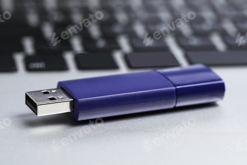 Preview: Usb flash drive on laptop, closeup view