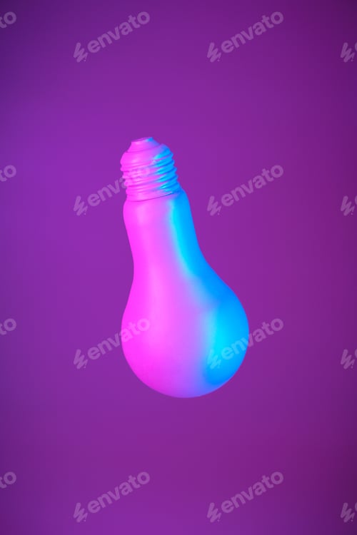 Preview: Lightbulb suspended in air on a bright purple background