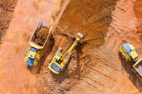 Preview: Backhoe working by digging soil at bucket teeth of backhoe digging soil and loads a dump truck with
