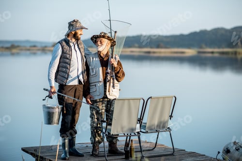 Preview: Grandfather with adult son fishing on the lake