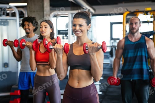 Preview: Group of happy people friends working out in gym together