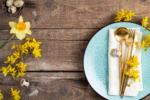 Preview: Holiday table setting with Easter decorations, spring flowers and gold cutlery. Easter table setting