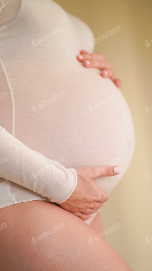 Preview: Close up of a woman Journey Through Pregnancy and Body Image. Maternity beautiful 9 month pregnancy