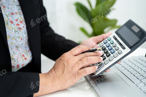 Preview: Asian accountant working and analyzing financial reports project