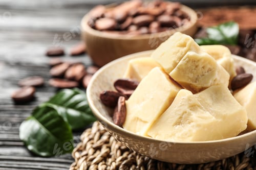 Preview: Organic cocoa butter on black wooden table, closeup