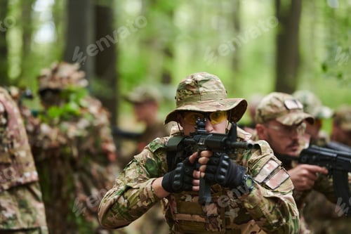 Preview: A disciplined and specialized military unit, donned in camouflage, strategically patrolling and