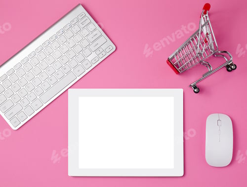 Preview: Feminine workplace concept. Shopping cart and tablet.