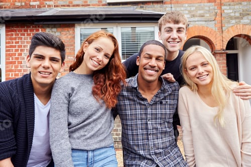 Preview: Portrait Of Group Of Smiling College Students Outside Rented Shared House
