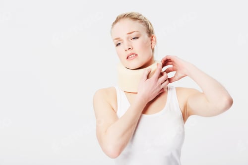 Preview: I just want to take this off already. Isolated image of a woman holding on to her neck brace.