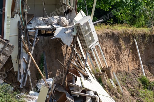Preview: View of house sinking into a recent storm-created sinkhole