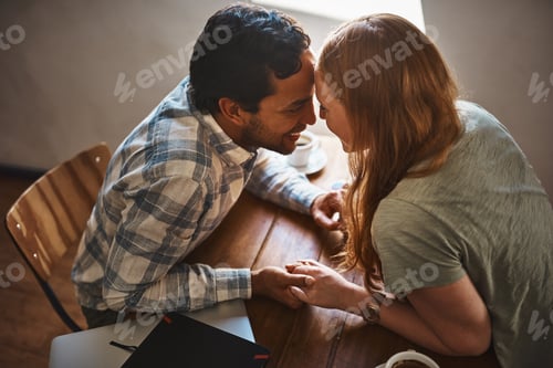 Preview: Shot of a young couple spending time together at a cafe