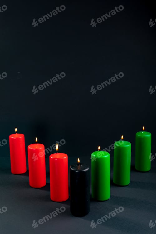 Preview: Composition of halloween candles and copy space on black background