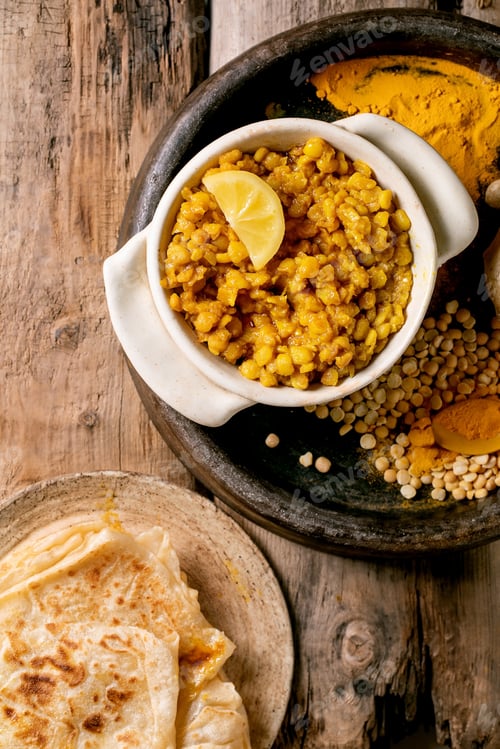 Preview: Traditional indian yellow pea food dal with roti bread
