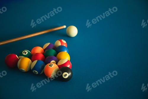 Preview: Billiard game setup with colorful balls and cue stick on blue felt