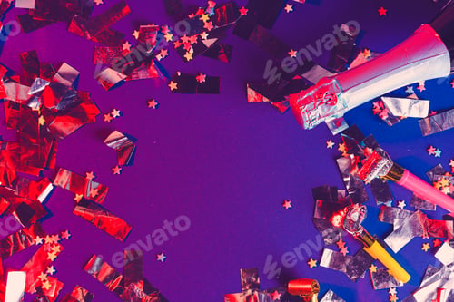 Preview: Champagne bottle on a purple background close up. Party concept
