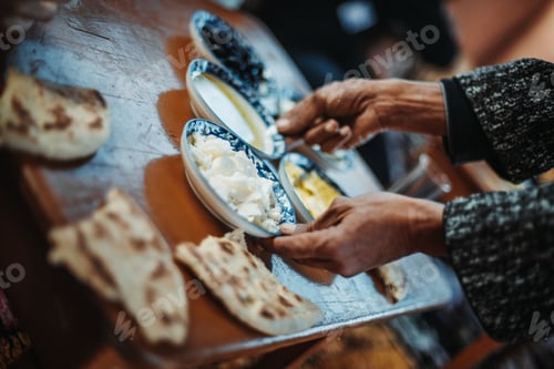 Preview: An elderly person setting up the table