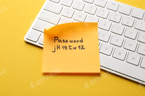 Preview: Sticky note with password and keyboard on yellow background, closeup
