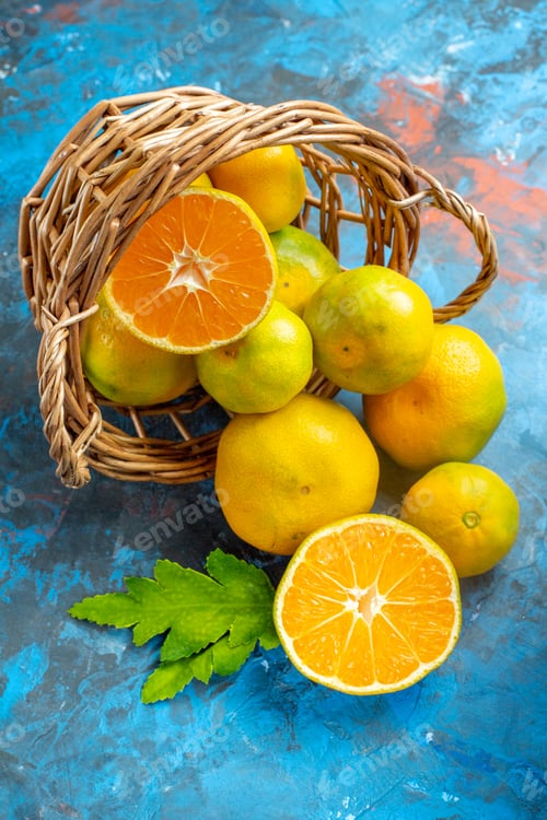 Preview: front view fresh mandarins on wicker basket on blue background