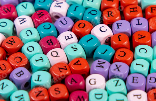 Preview: Set of blocks spell with different letters and colors, ornament with many wooden cubic beads