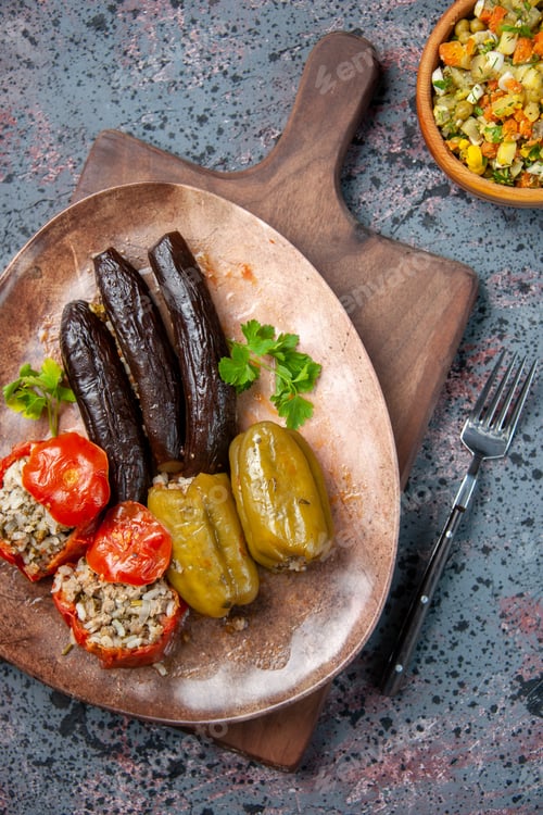 Preview: top view delicious vegetable dolma with salad on blue background food dinner color meal health