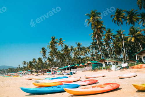 Preview: Canacona, Goa, India. Canoe Kayak For Rent Parked On Famous Palolem Beach On Background Tall Palm