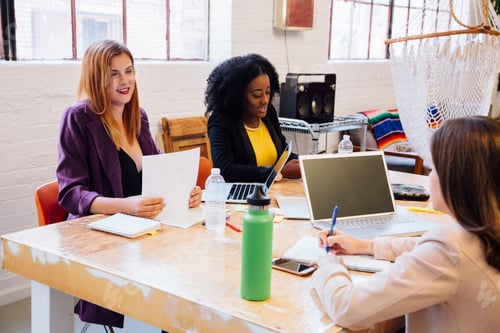 Preview: Colleagues in industrial office building working at desk