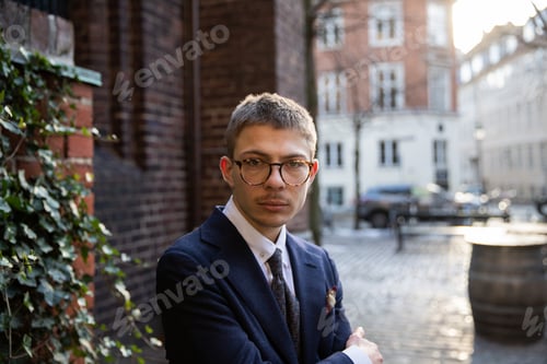 Preview: portrait of a young elegant businessman outside