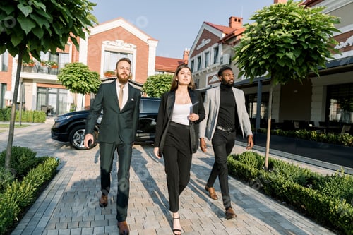 Preview: Dynamic Business team, Caucasian woman and man, African man, hurry to outdoor meeting, black car and