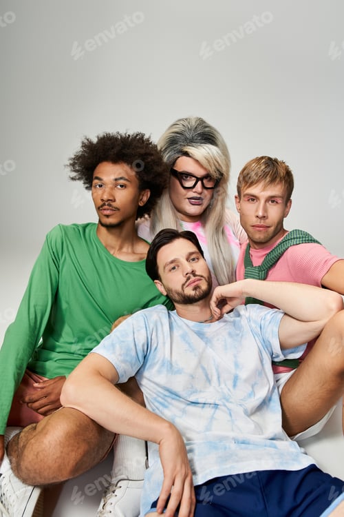 Preview: Four vibrant individuals expressing queer identity through fashion and pose in a studio setting