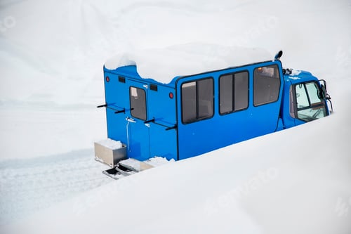 Preview: Rear back door window view blue modern snowcat ratrack grooming machine with cabine box preparing