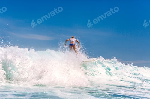 Preview: Surfing time for sporty lady.