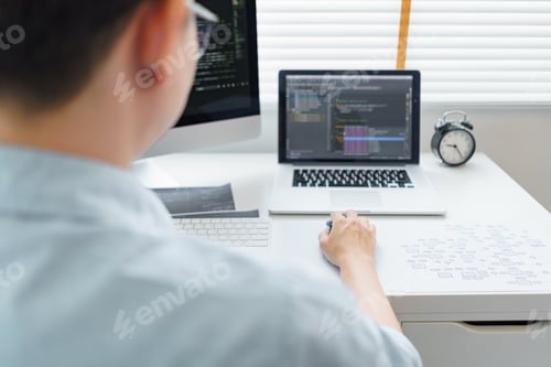 Preview: Software development concept, Male programmer typing data code on laptop to develop app and website