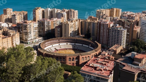 Preview: Malaga bullring surrounded by buildings from elevated view