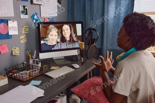 Preview: Woman using computer for online conversation