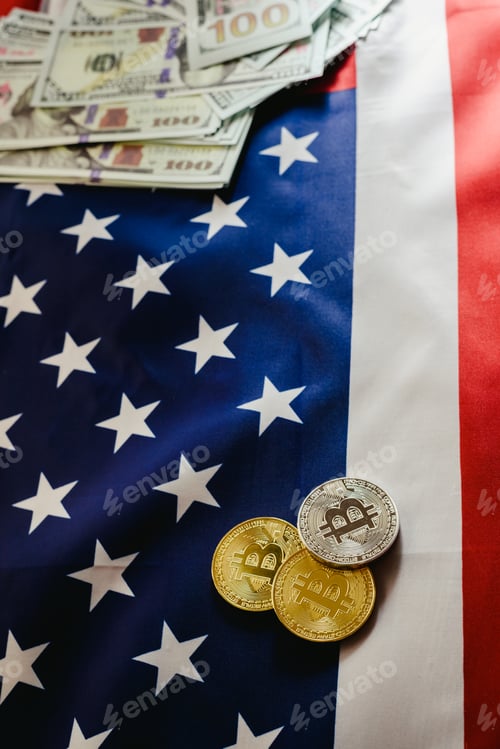 Preview: Bitcoin physical coins on American flag background with dollars in the background.