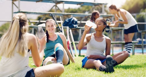 Preview: Sport, outdoor and women relax with water bottle, hydration and rest, field hockey athlete take tra