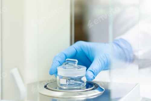 Preview: The operator is weighing the empty weighing bottle on the balance for glassware calibration.