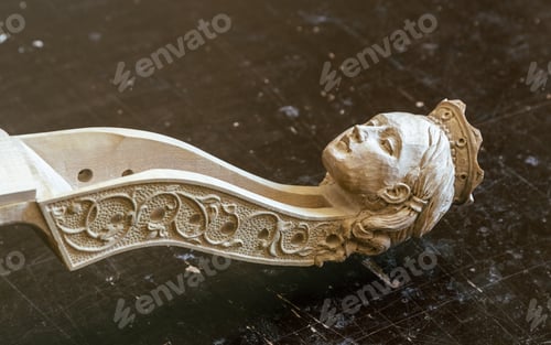 Preview: Detail of the headstock handmade by a luthier from a cello