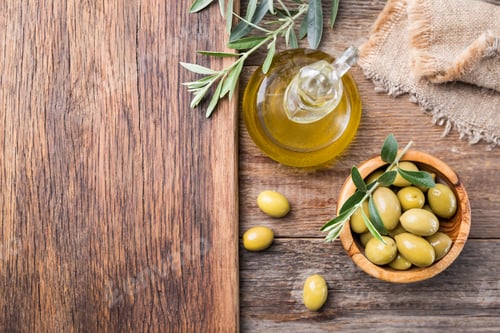 Preview: Olives and Olive Oil on Wooden Background