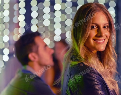Preview: Enjoying the nightlife. Portrait of a beautiful young woman enjoying the night out at a club.