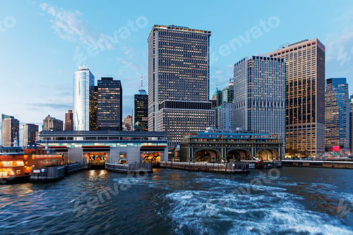 Preview: A vibrant sunset panorama of Manhattan downtown skyline, viewed from the river