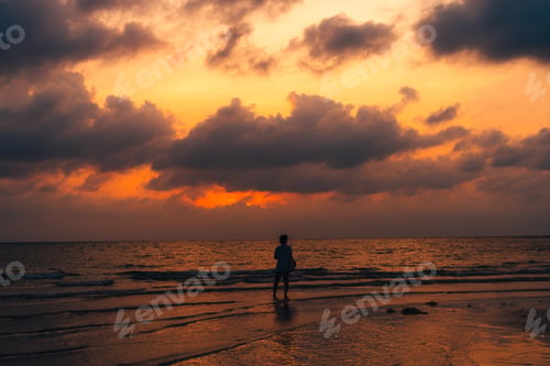 Preview: Sunset at sea with orange sky and waves