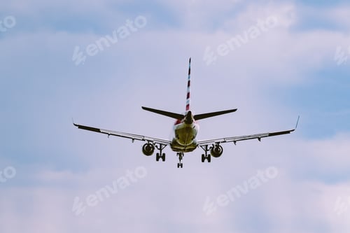 Preview: Beautiful view of an airplane flying in a cloudy sky