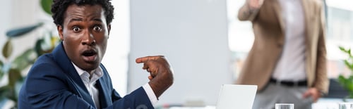 Preview: panoramic shot of shocked african american businessman pointing with finger at himself in office