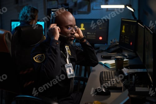 Preview: Black Man Working as Security Officer in Surveillance Control Room