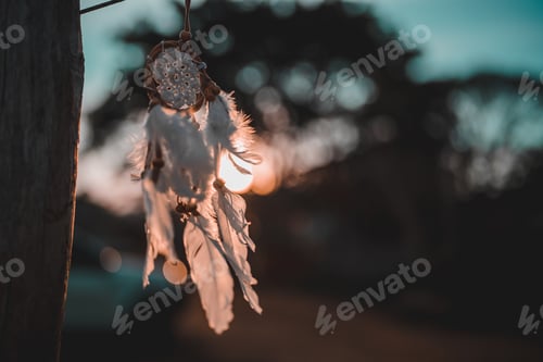 Preview: Dreamcatcher Against Cloudy Sky During Sunset, Dreamcatcher is a American native amulet